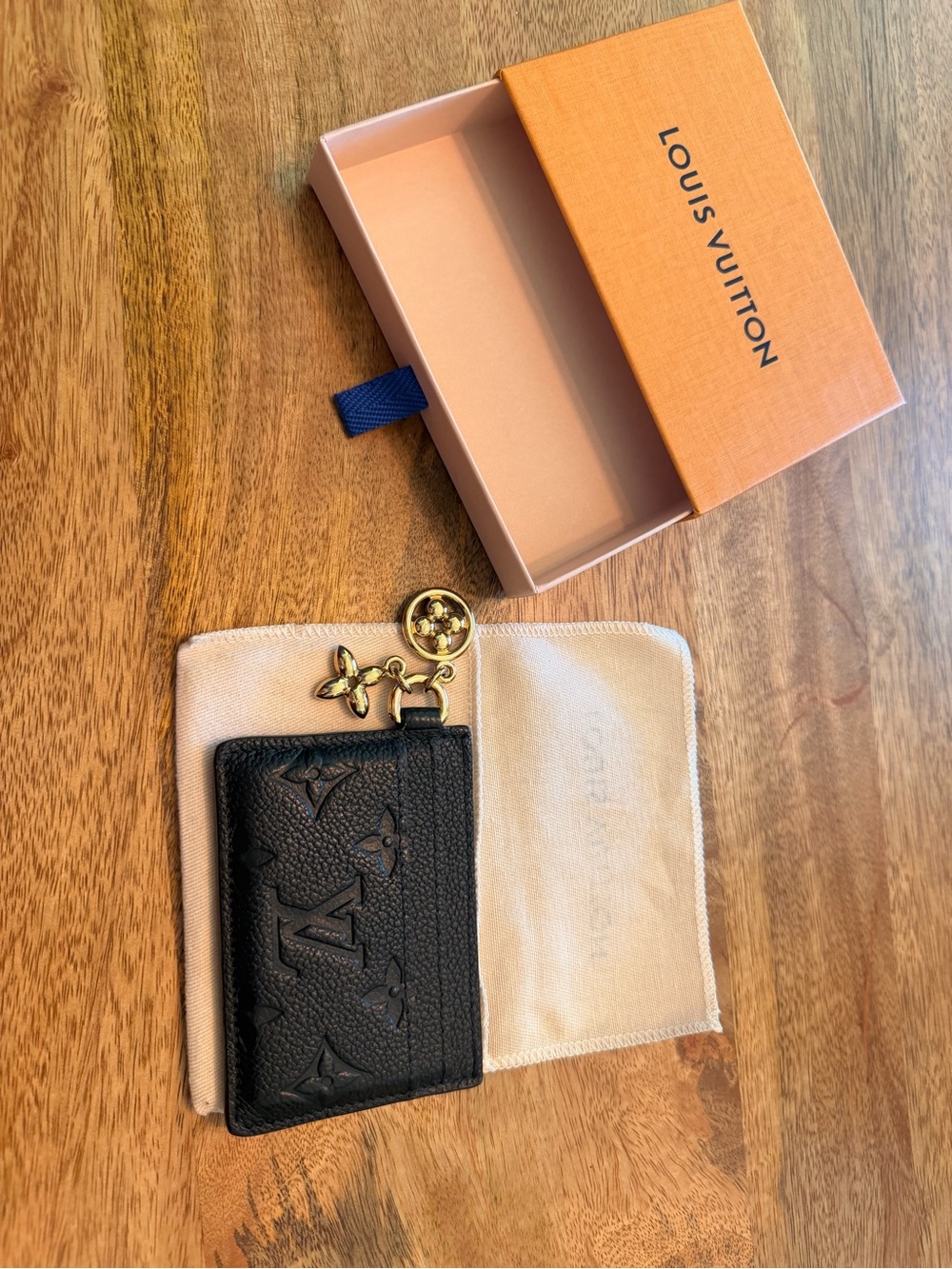 Authentic Louis Vuitton Black Leather Monogram Card Case with Gold Charm